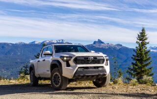 White Toyota Tacoma Truck in front of mountains