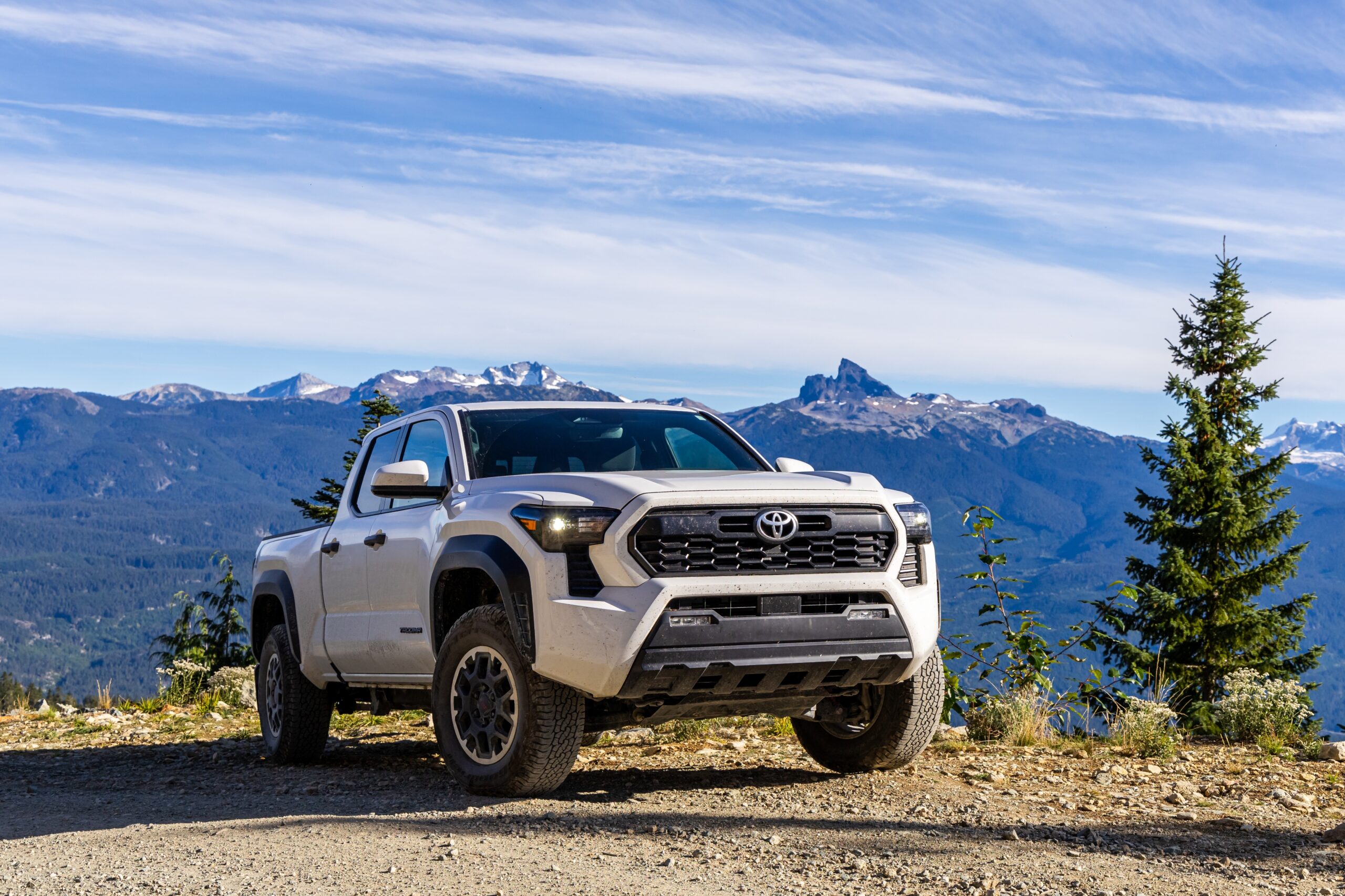 White Toyota Tacoma Truck in front of mountains